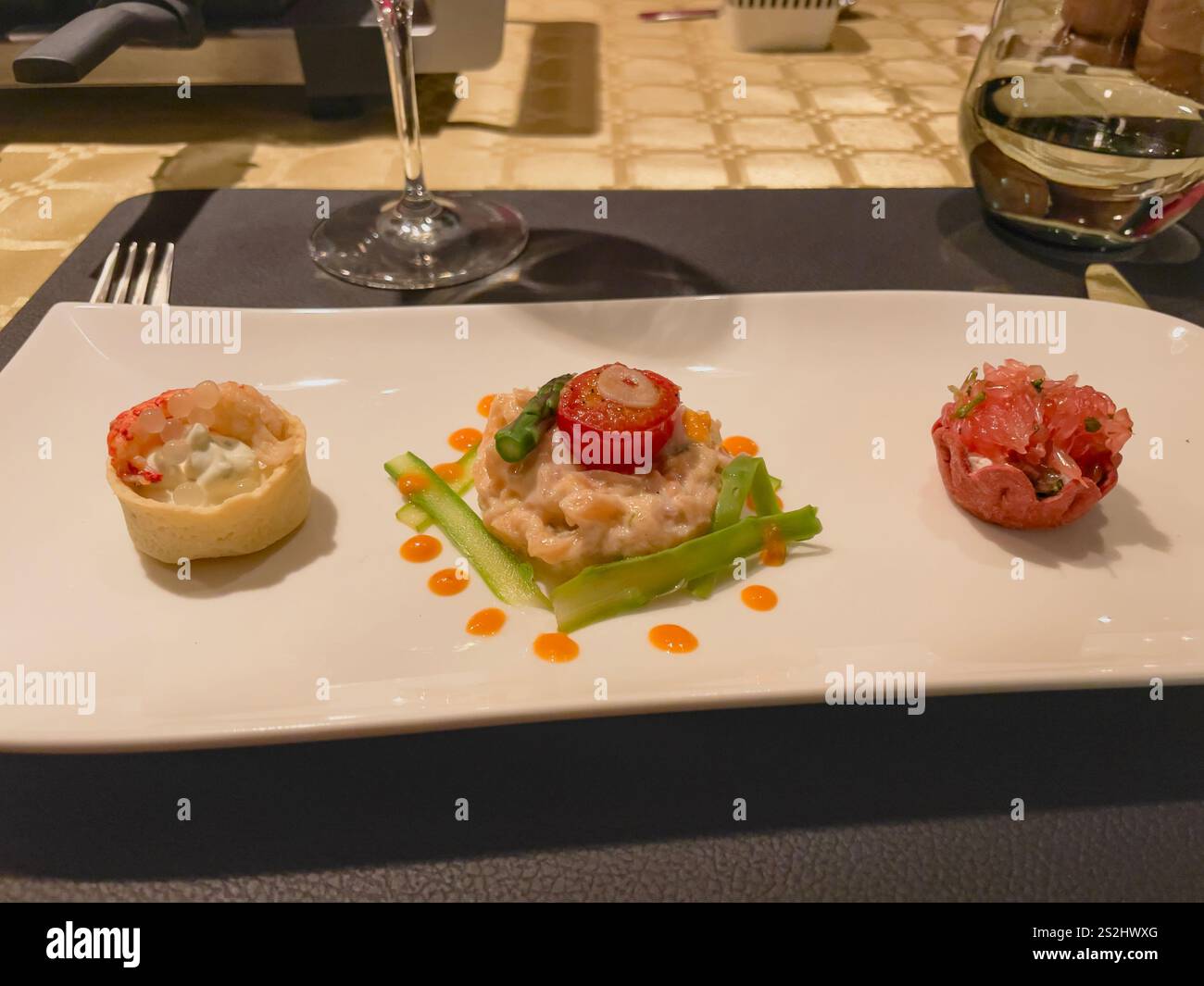 Exquisite gourmet dishes elegantly presented in a fine dining restaurant. Luxurious ingredients and artistic plating showcase culinary mastery. Stock Photo