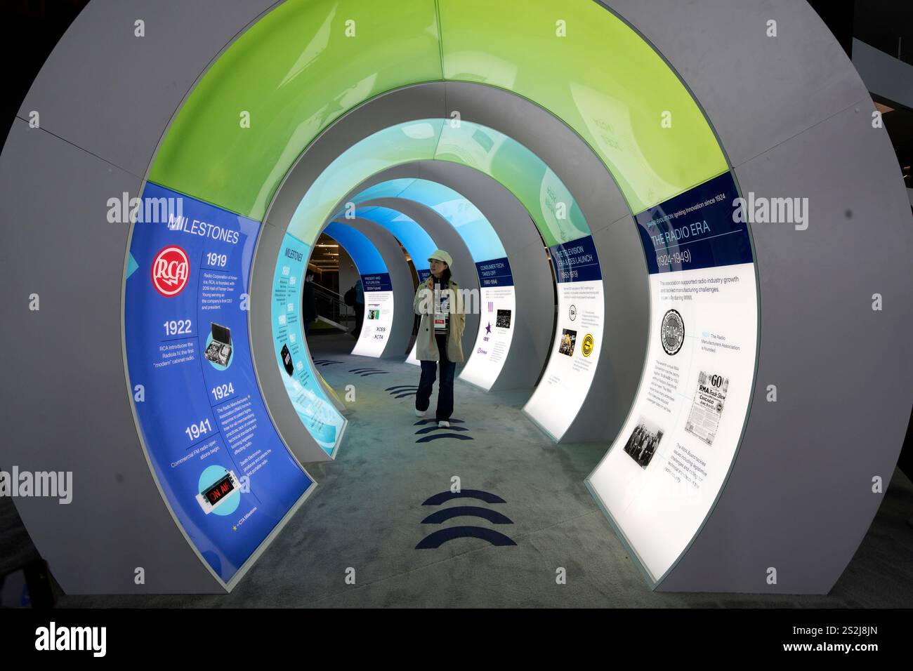 A person views an exhibit on the history of CES during the CES tech