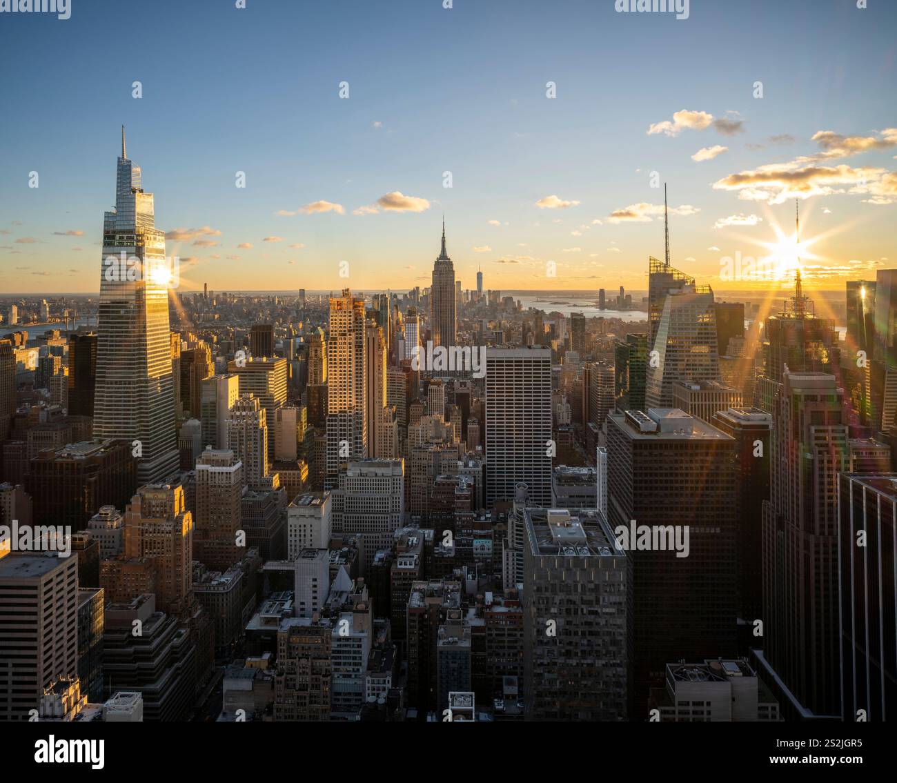 Colorful Manhattan Skyline, illuminated at sunset Manhattan, New York City New York, USA Stock Photo