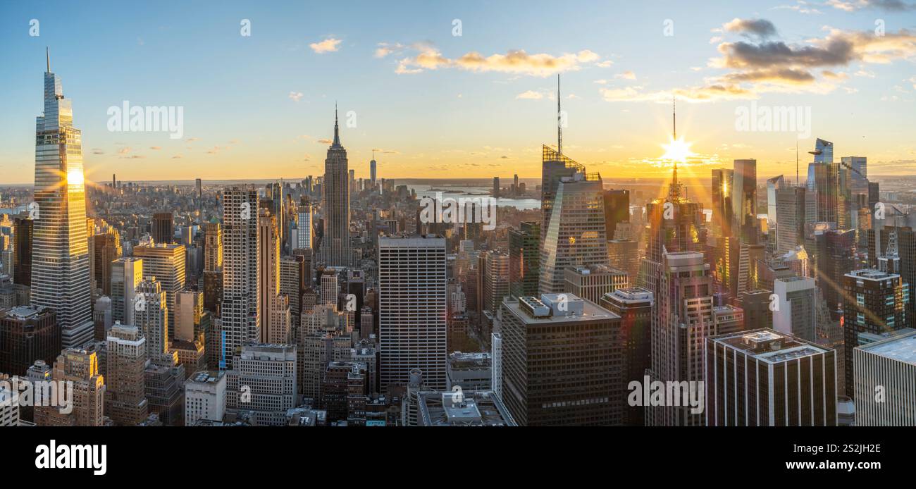 Colorful Manhattan Skyline, illuminated at sunset Manhattan, New York City New York, USA Stock Photo