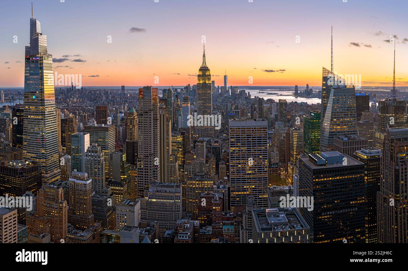 Colorful Manhattan Skyline, illuminated at sunset Manhattan, New York City New York, USA Stock Photo
