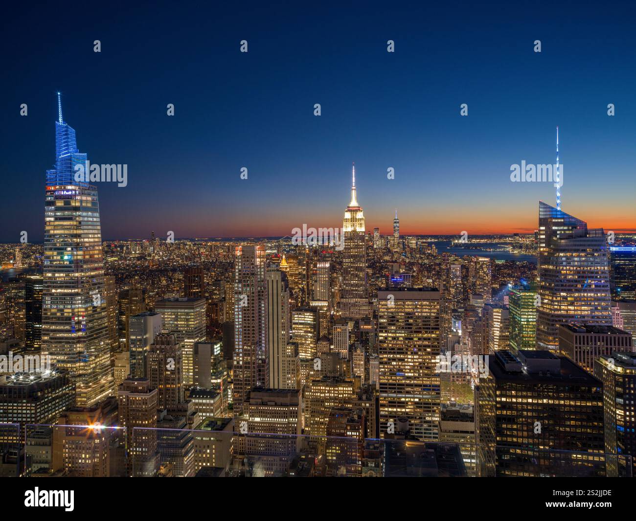 Colorful Manhattan Skyline, illuminated at sunset Manhattan, New York City New York, USA Stock Photo