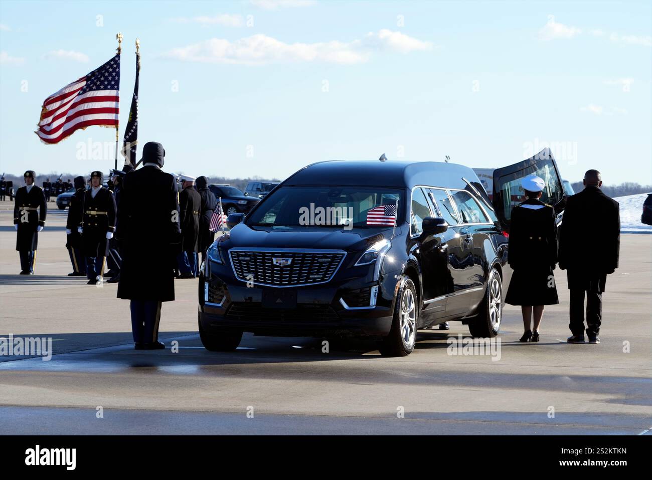 The flagdraped casket of former President Jimmy Carter is placed into