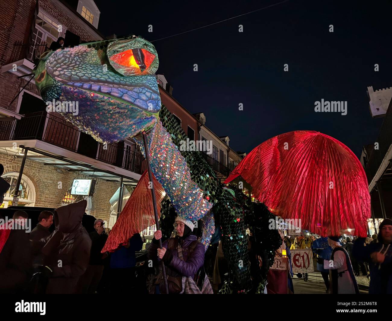 Volunteers carry a makeshift dragon through the streets of New Orleans