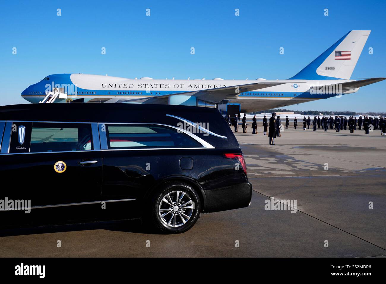 The hearse carrying the flagdraped casket of former President Jimmy
