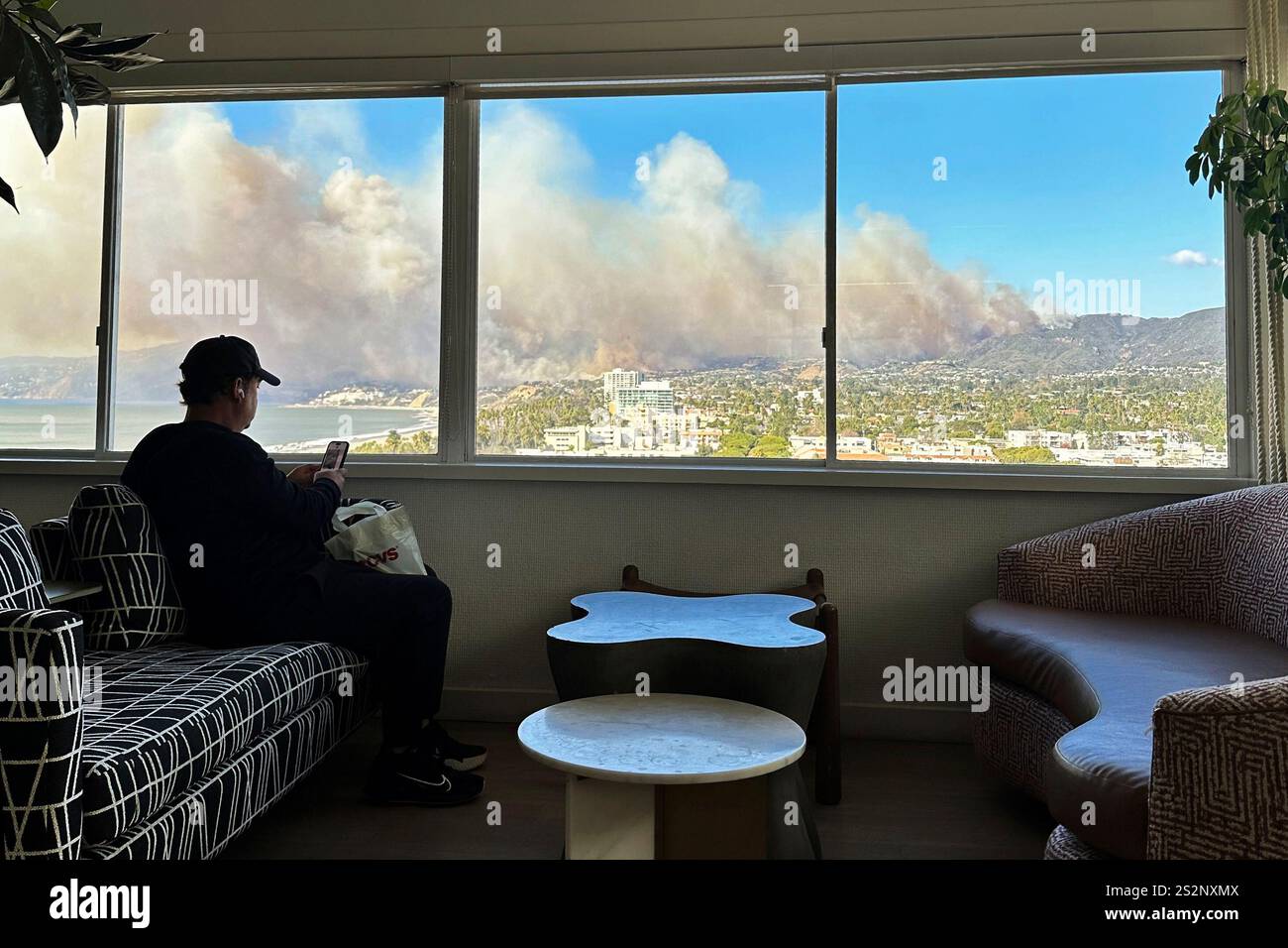 Smoke rises from the Palisades Fire in Los Angeles as seen from Santa