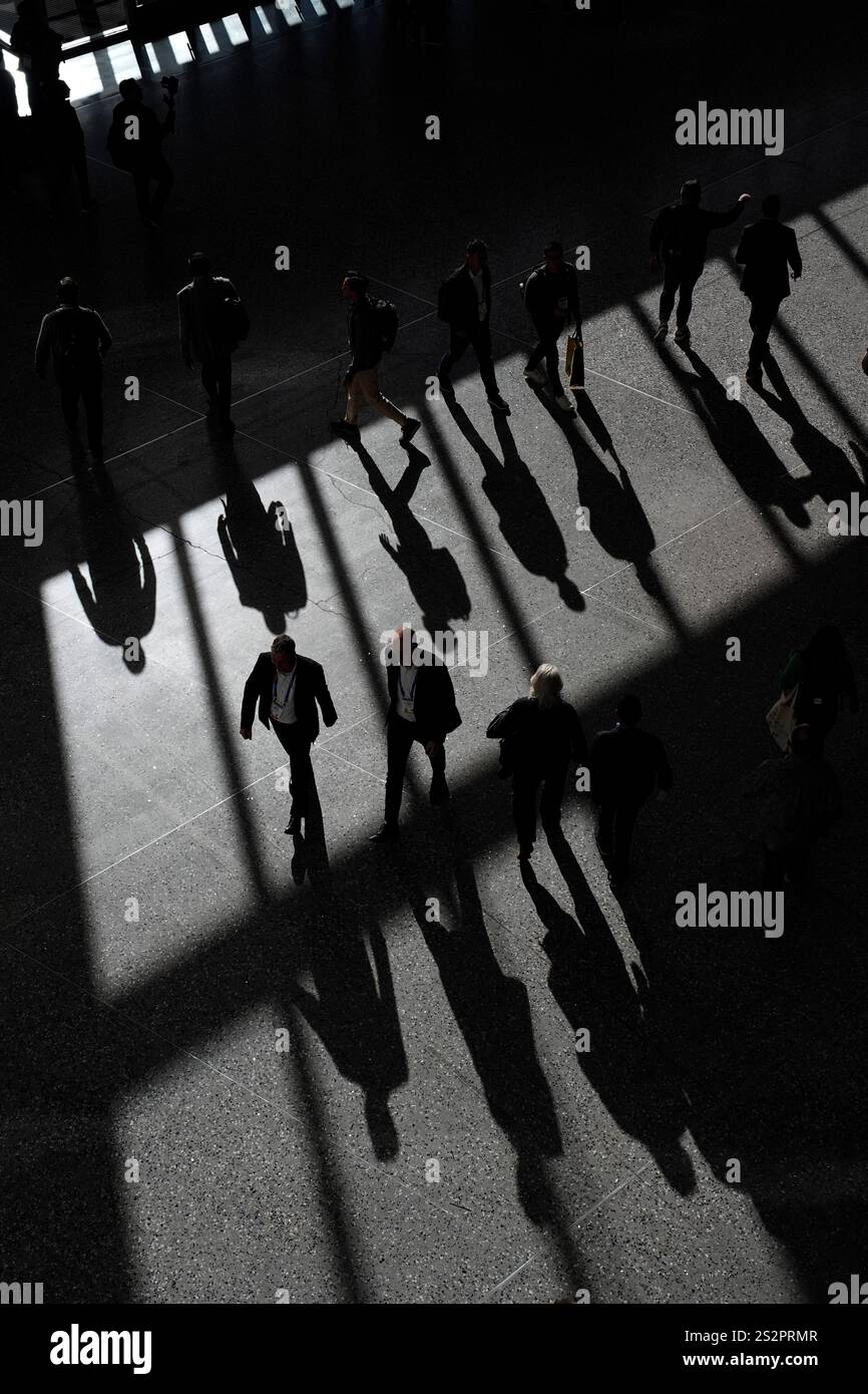 People walk through the Las Vegas Convention Center during the CES tech ...