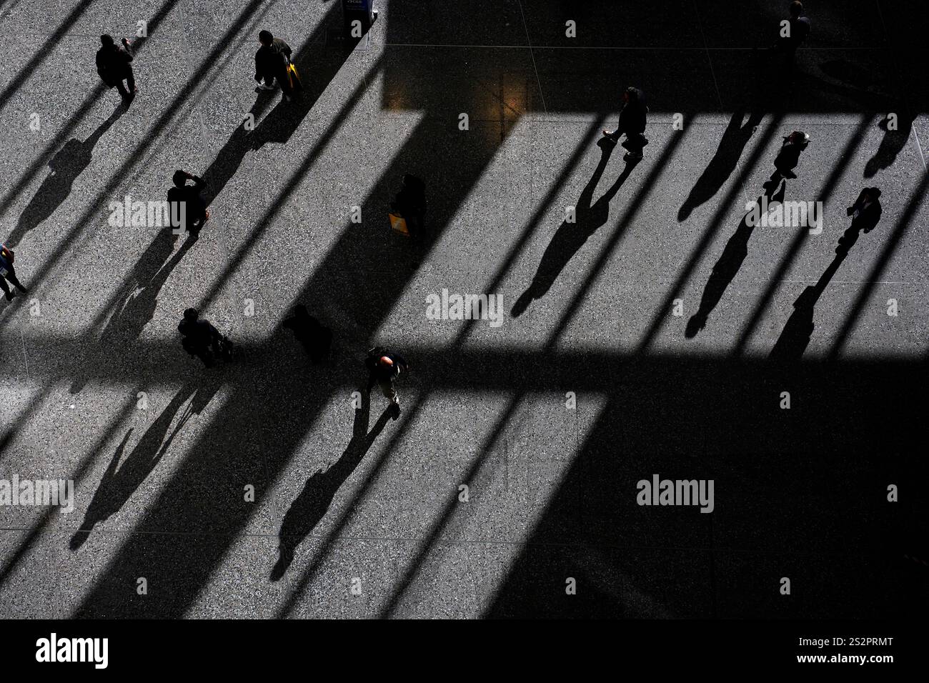 People walk through the Las Vegas Convention Center during the CES tech ...