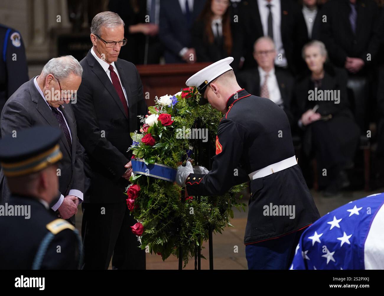 Washington, United States. 07th Jan, 2025. Sen. Chuck Schumer, D-NY, and Senate Majority Leader John Thune, R-SD, pay their respects as the flag-draped casket of former President Jimmy Carter lies in state in the U.S. Capitol Rotunda in Washington DC on Tuesday, January 7, 2025. Carter, the 39th president, died at the age of 100 on December 29 at his home in Plains, Georgia. Photo by Bonnie Cash/UPI Credit: UPI/Alamy Live News Stock Photo
