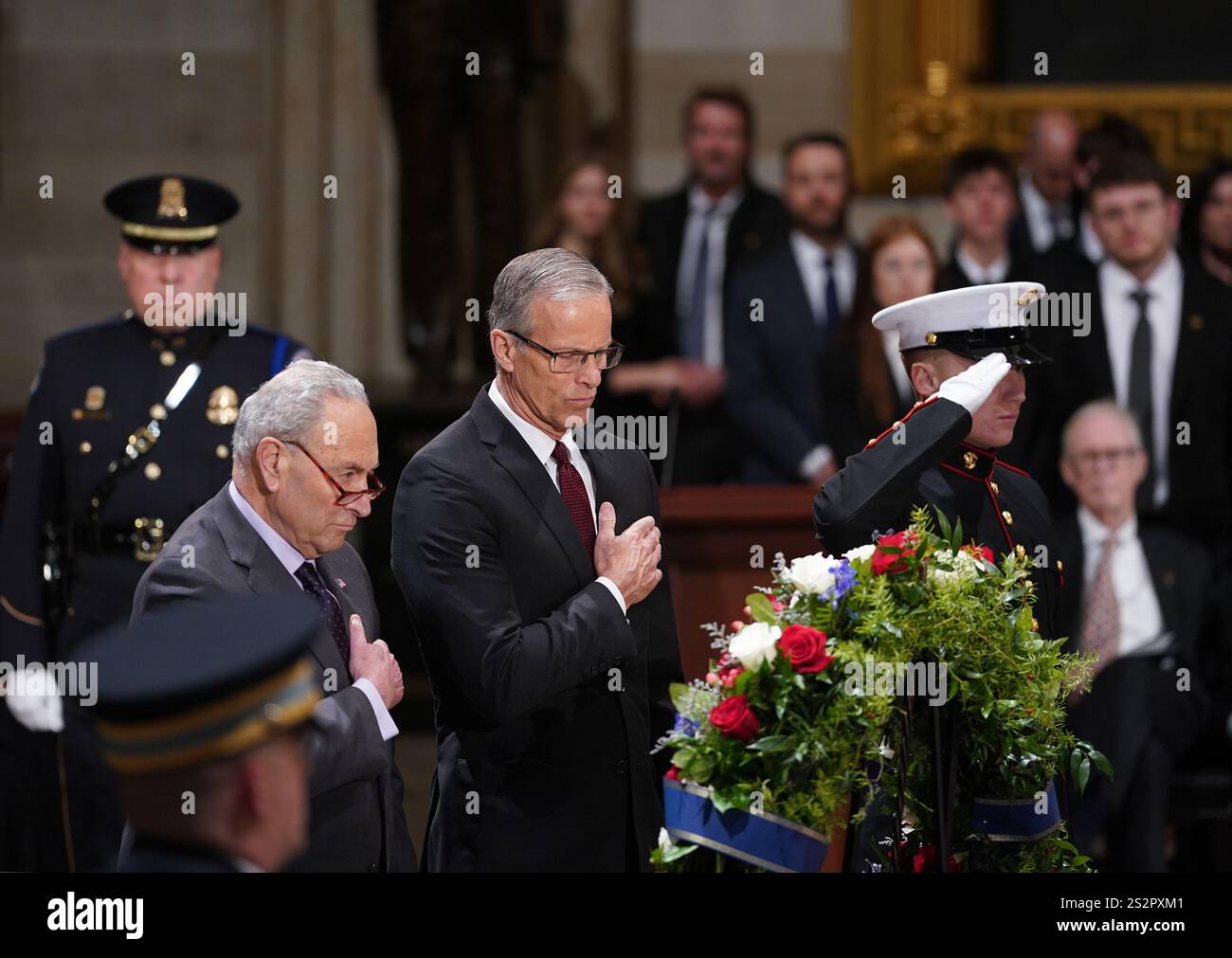 Washington, United States. 07th Jan, 2025. Sen. Chuck Schumer, D-NY, and Senate Majority Leader John Thune, R-SD, pay their respects as the flag-draped casket of former President Jimmy Carter lies in state in the U.S. Capitol Rotunda in Washington DC on Tuesday, January 7, 2025. Carter, the 39th president, died at the age of 100 on December 29 at his home in Plains, Georgia. Photo by Bonnie Cash/UPI Credit: UPI/Alamy Live News Stock Photo