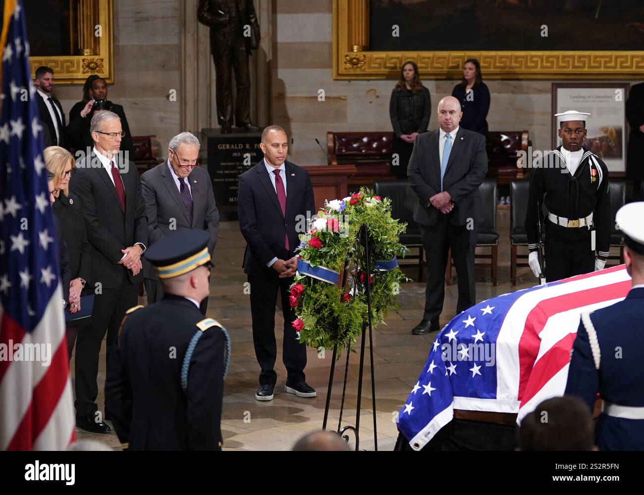Washington, United States. 07th Jan, 2025. Sen. Chuck Schumer, D-NY, Senate Majority Leader John Thune, R-SD, and House Minority Leader Hakeem Jeffries, D-NY, pay their respects as the flag-draped casket of former President Jimmy Carter, lies in state in the U.S. Capitol Rotunda in Washington DC on Tuesday, January 7, 2025. Carter, the 39th president, died at the age of 100 on December 29 at his home in Plains, Georgia. Photo by Bonnie Cash/UPI Credit: UPI/Alamy Live News Stock Photo