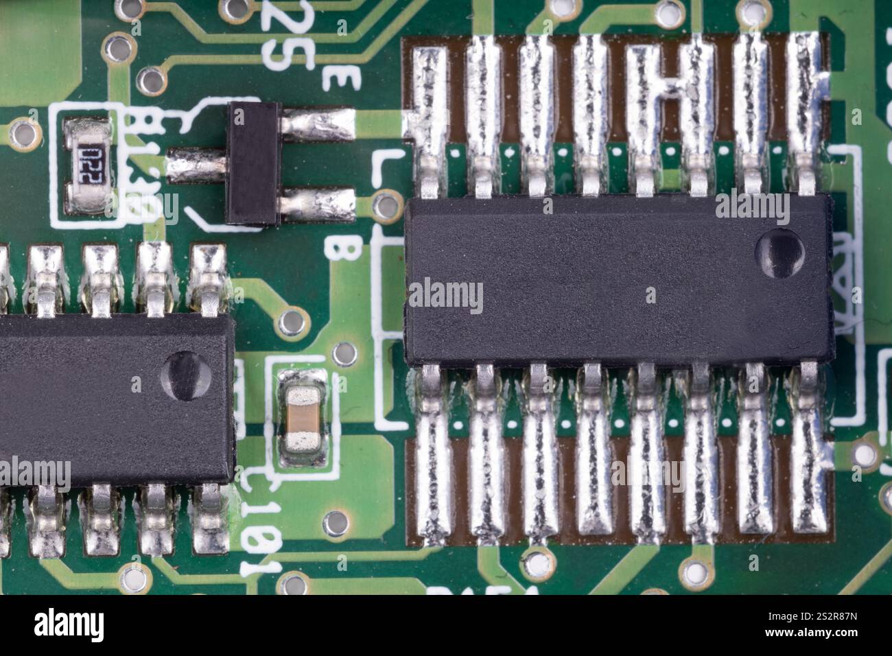 Integrated circuits on green circuit board Stock Photo