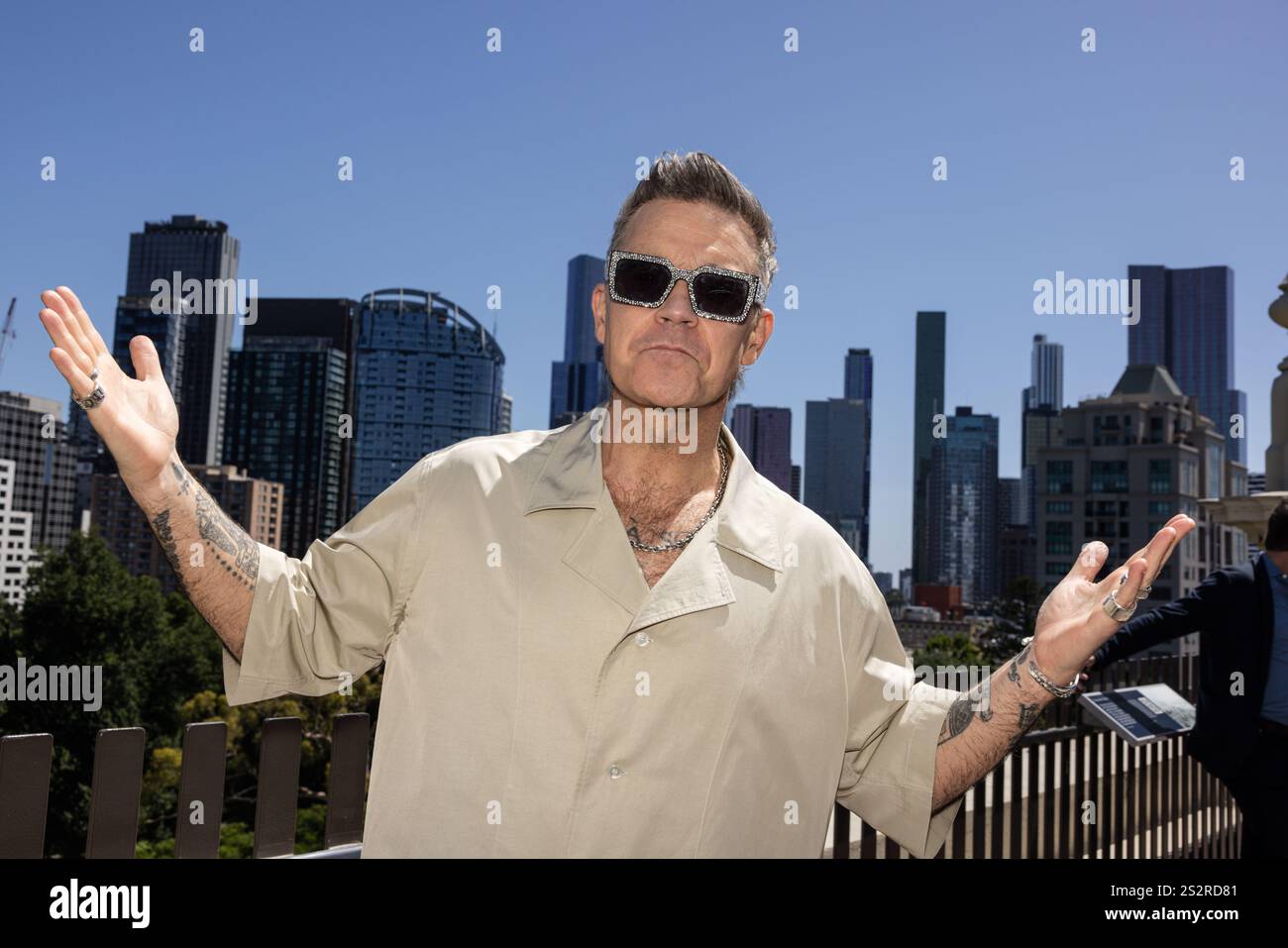Robbie Entertainer Robbie Williams poses for a photograph during press ...