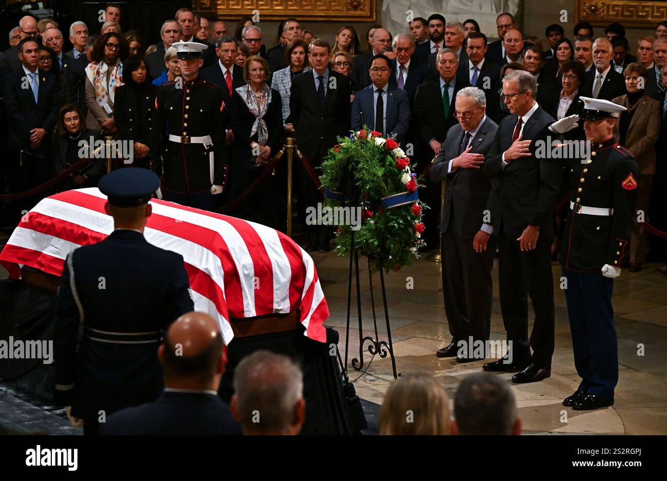 Washington, United States. 07th Jan, 2025. Senate Democratic leader Chuck Schumer (D-NY) and Senate Majority Leader John Thune pay their respects as flag-draped casket of former President Jimmy Carter lies in state in the U.S. Capitol Rotunda in Washington DC on Tuesday, January 7, 2025. Carter, the 39th president, died at the age of 100 on December 29 at his home in Plains, Georgia. Pool photo by Ricky Carioti/UPI Credit: UPI/Alamy Live News Stock Photo