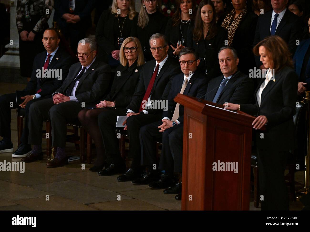 From left, House Minority Leader Hakeem Jeffries (D-NY), Senate Democratic leader Chuck Schumer (D-NY), Kimberley Thune, Senate Majority Leader John Thune (R-SD), House Speaker Mike Johnson (R-La.), and second gentleman Doug Emhoff listen as Vice President Kamala Harris speaks at a lying in state ceremony for former President Jimmy Carter at the US Capitol Rotunda in Washington, DC on Tuesday, January 7, 2025. Carter, the 39th president, died at the age of 100 on December 29 at his home in Plains, Georgia. Pool photo by Ricky Carioti/UPI Stock Photo