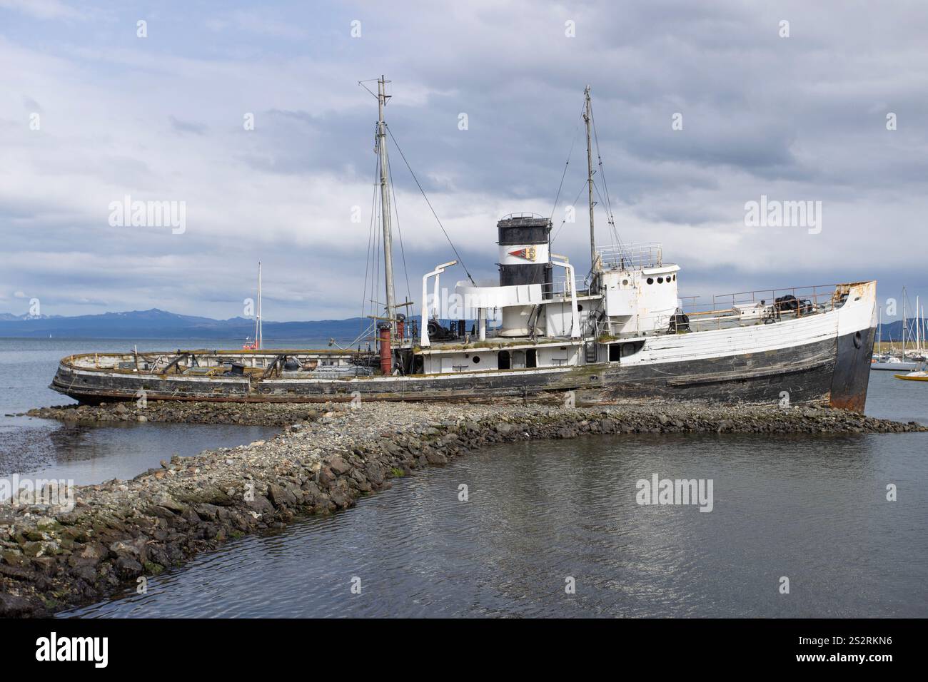 The wreck of the St. Christopher, previously H.M.S. Justice of the British Royal Navy, and BATR-20 the the US Navy. Abandoned in Ushuaia, Argentina. Stock Photo