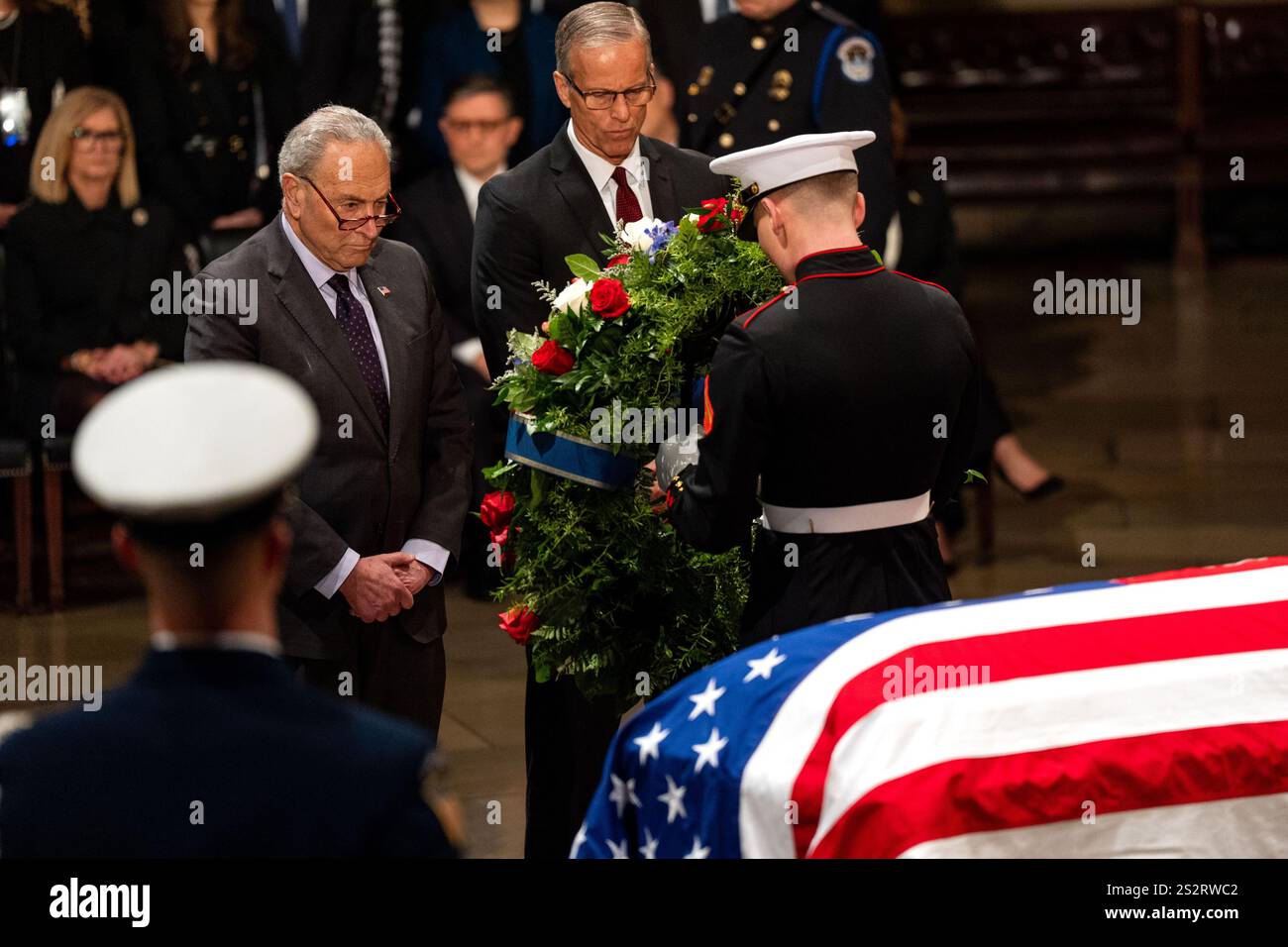 Washington, United States. 07th Jan, 2025. Sen. Chuck Schumer (D-NY) and Sen. John Thune (R-SD) present a wreath as former President Jimmy Carter lies in state at the US Capitol Rotunda in Washington, DC on Tuesday, January 7, 2025. Carter, the 39th president, died at the age of 100 on December 29 at his home in Plains, Georgia. Pool photo by Kent Nishimura/UPI Credit: UPI/Alamy Live News Stock Photo