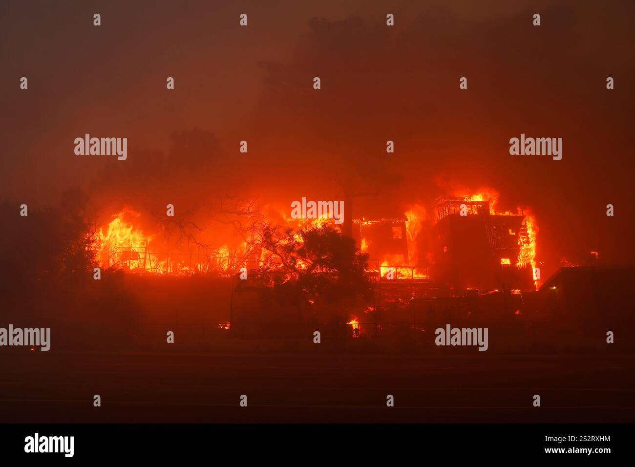 The Palisades Fire burns a property in the Pacific Palisades