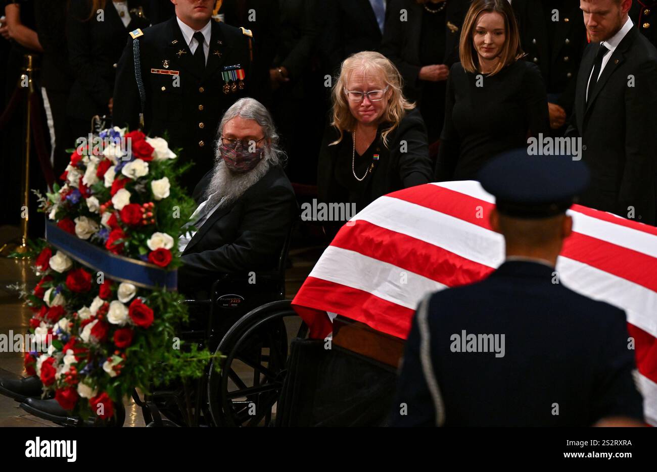Amy Carter touches her father's casket as former President Jimmy Carter