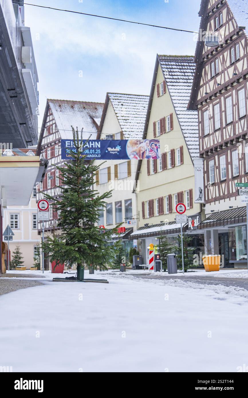 Snow-covered street in a town with traditional half-timbered ...