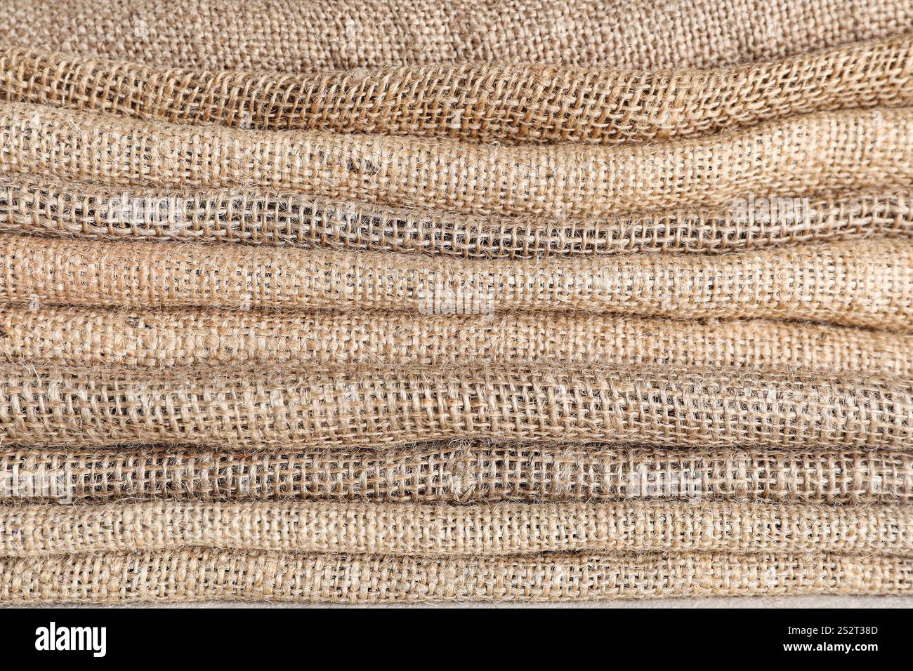 Stack of folded burlap fabric, closeup Stock Photo