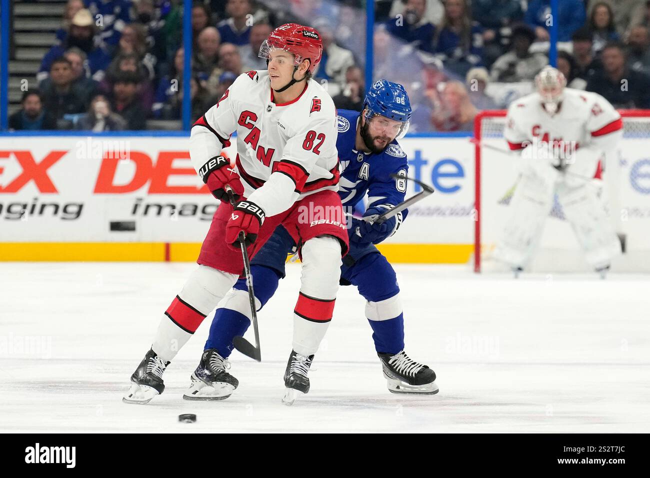 Carolina Hurricanes center Jesperi Kotkaniemi (82) gets past Tampa Bay