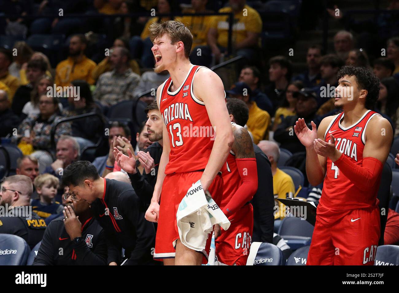 Arizona guard Will Kuykendall (12) and forward Trey Townsend (4) react