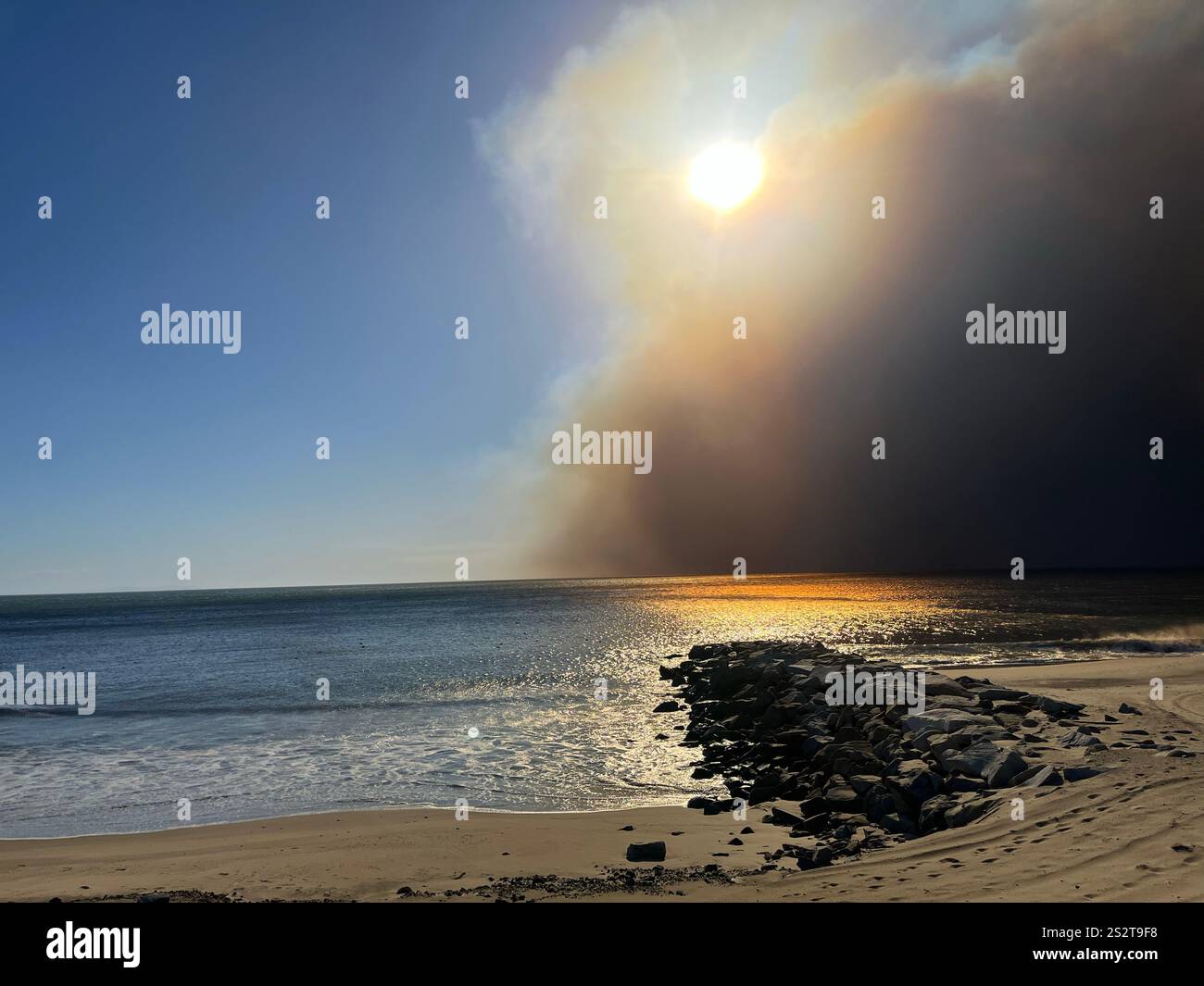 Palisades Fire, the beach bike path south of Sunset Blvd, smoke blowing out to ocean, Fire Department, LAPD staging areas on PCH, day one 1/7/2025. - Smartphone Captured Stock Image