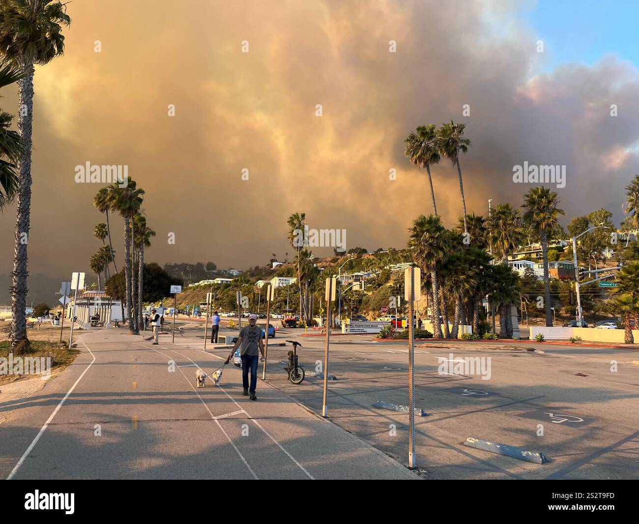 Palisades Fire, the beach bike path south of Sunset Blvd, smoke blowing out to ocean, Fire Department, LAPD staging areas on PCH, day one 1/7/2025. - Smartphone Captured Stock Image