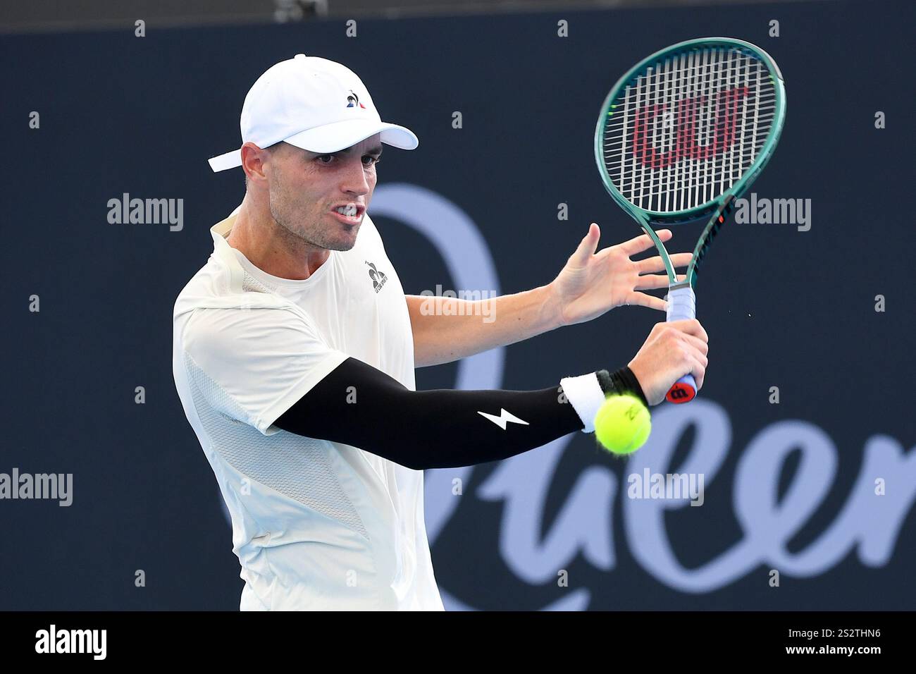 Christopher O'Connell of Australia plays a shot against Alex Michelsen ...