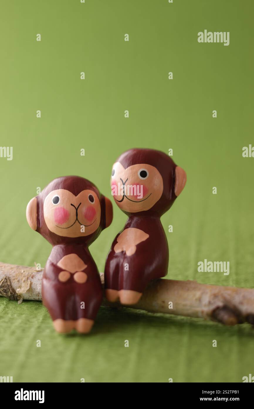 Green Background with Monkey Puppet Stock Photo - Alamy
