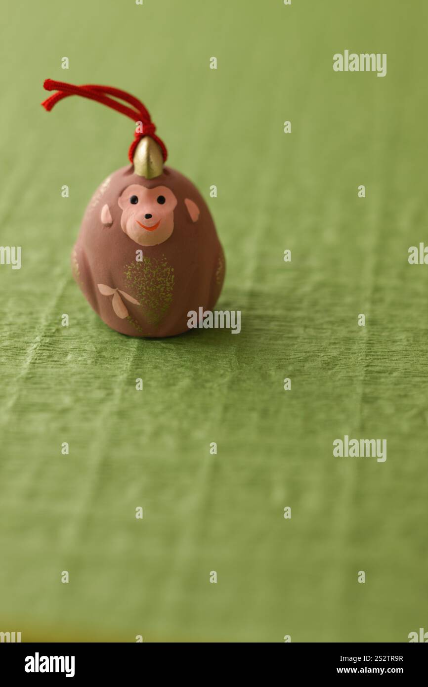 Green Background with Monkey Puppet Stock Photo - Alamy