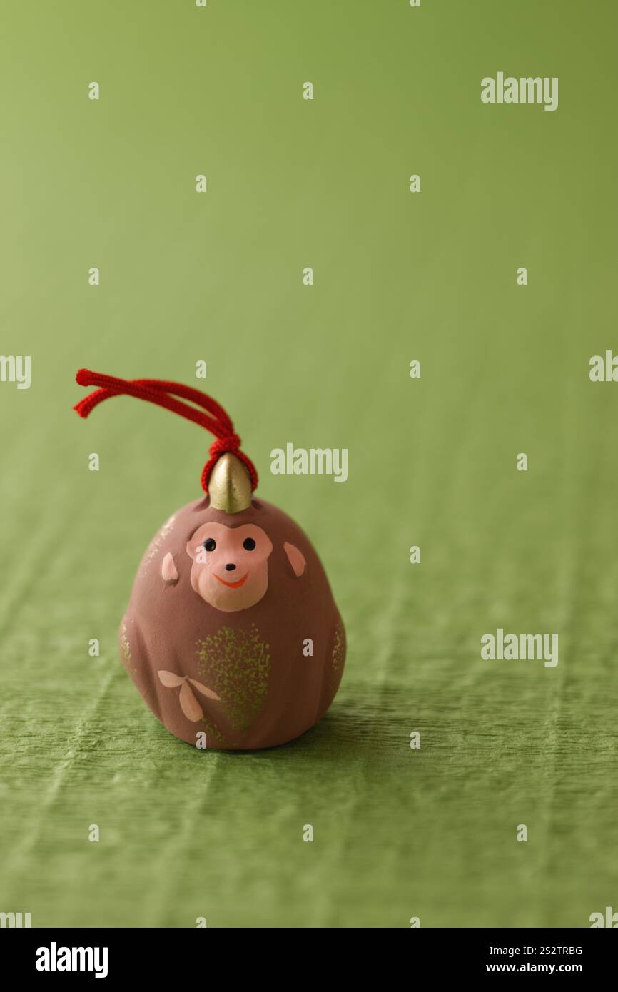 Green Background with Monkey Puppet Stock Photo - Alamy