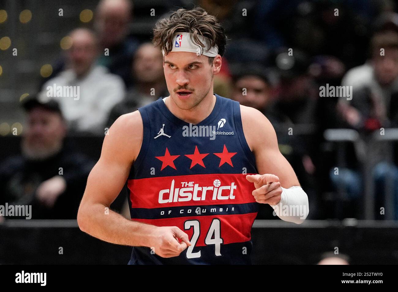 Washington Wizards forward Corey Kispert gestures after scoring a three