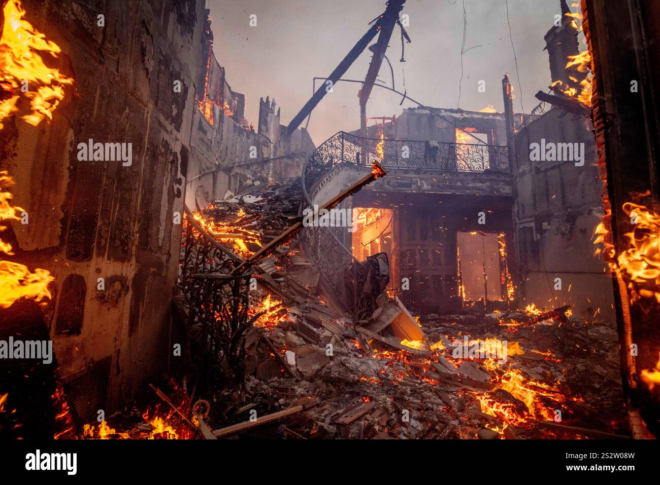 The Palisades Fire burns a residence in the Pacific Palisades