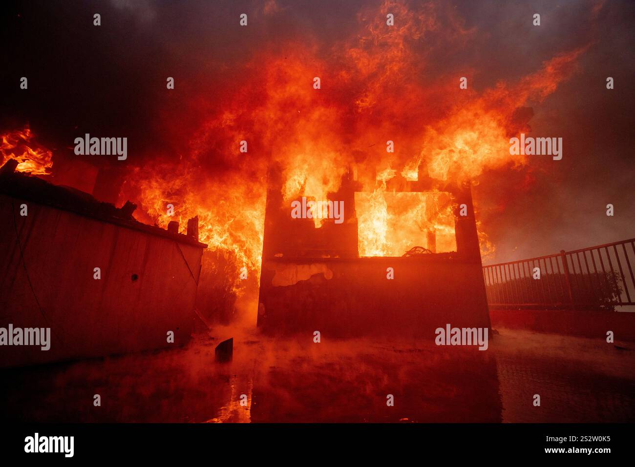 The Palisades Fire burns a property in the Pacific Palisades