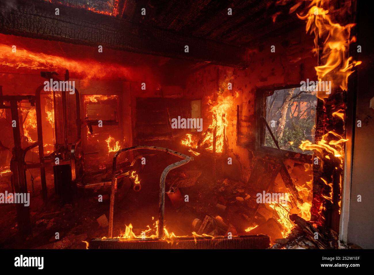 The Palisades Fire burns a residence in the Pacific Palisades