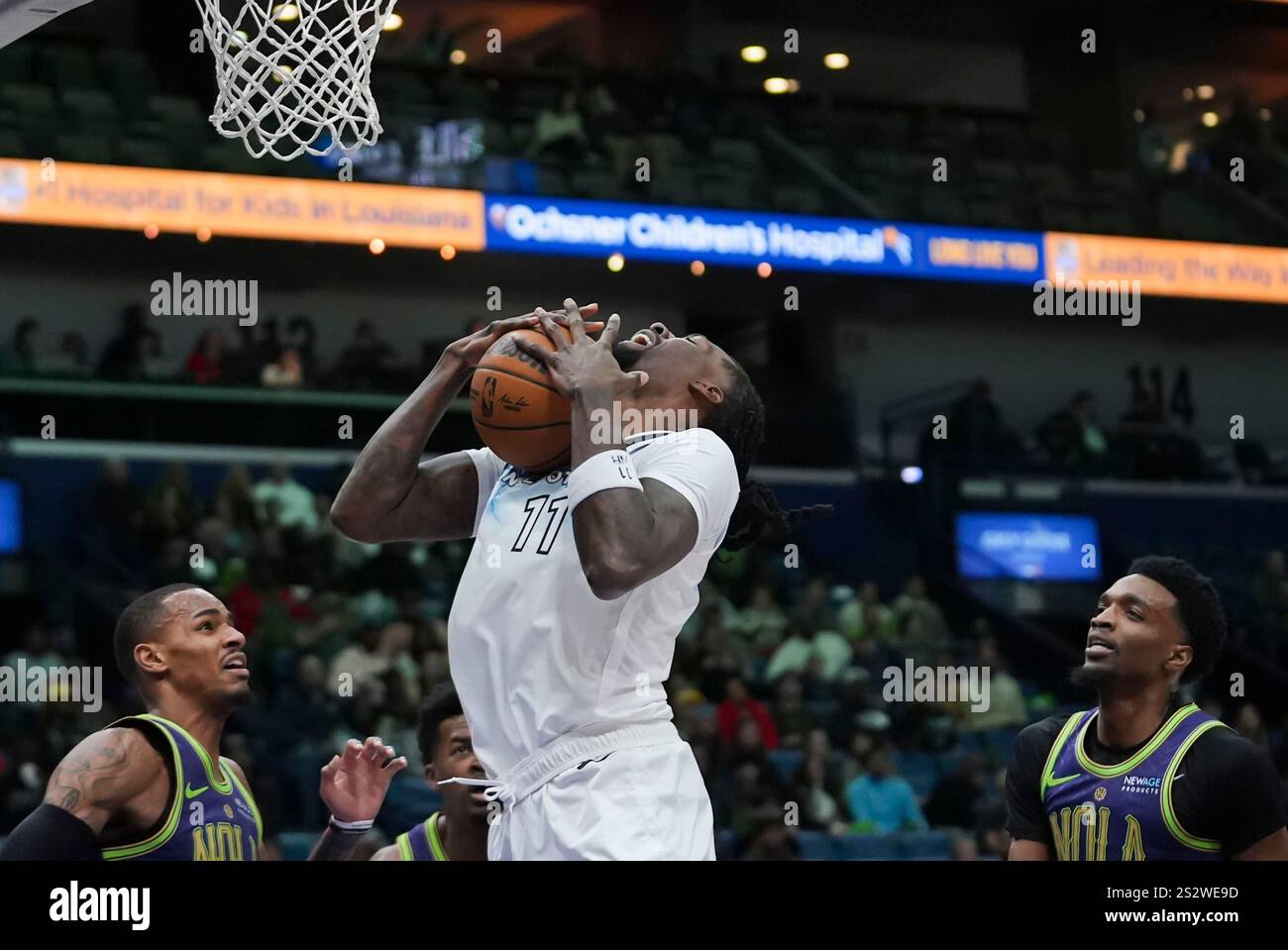 Minnesota Timberwolves center Naz Reid (11) pulls down a rebound in the