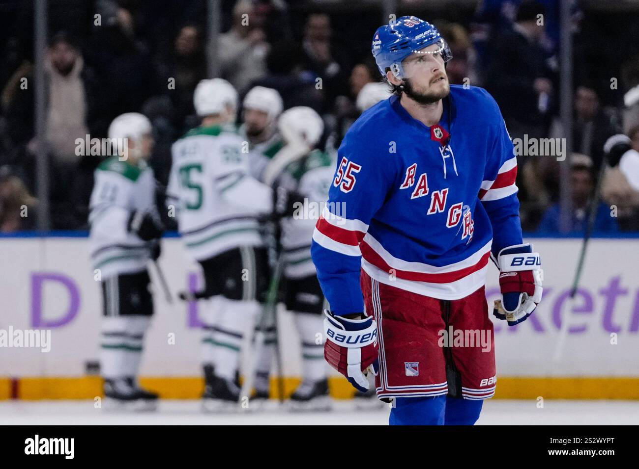 New York Rangers' Ryan Lindgren (55) leaves the ice after an NHL hockey