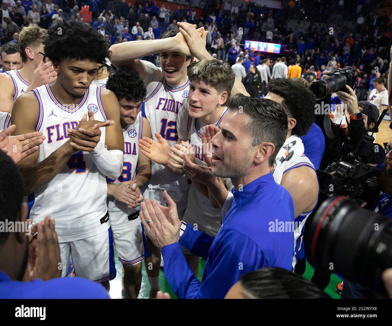 Florida head coach Todd Golden, right, and the rest of the Florida team