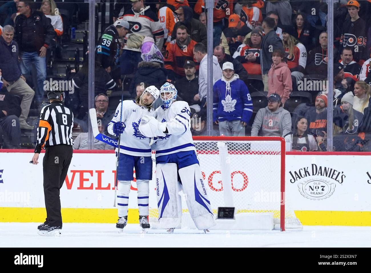 Toronto Maple Leafs' Chris Tanev (8) and Joseph Woll (60) celebrate