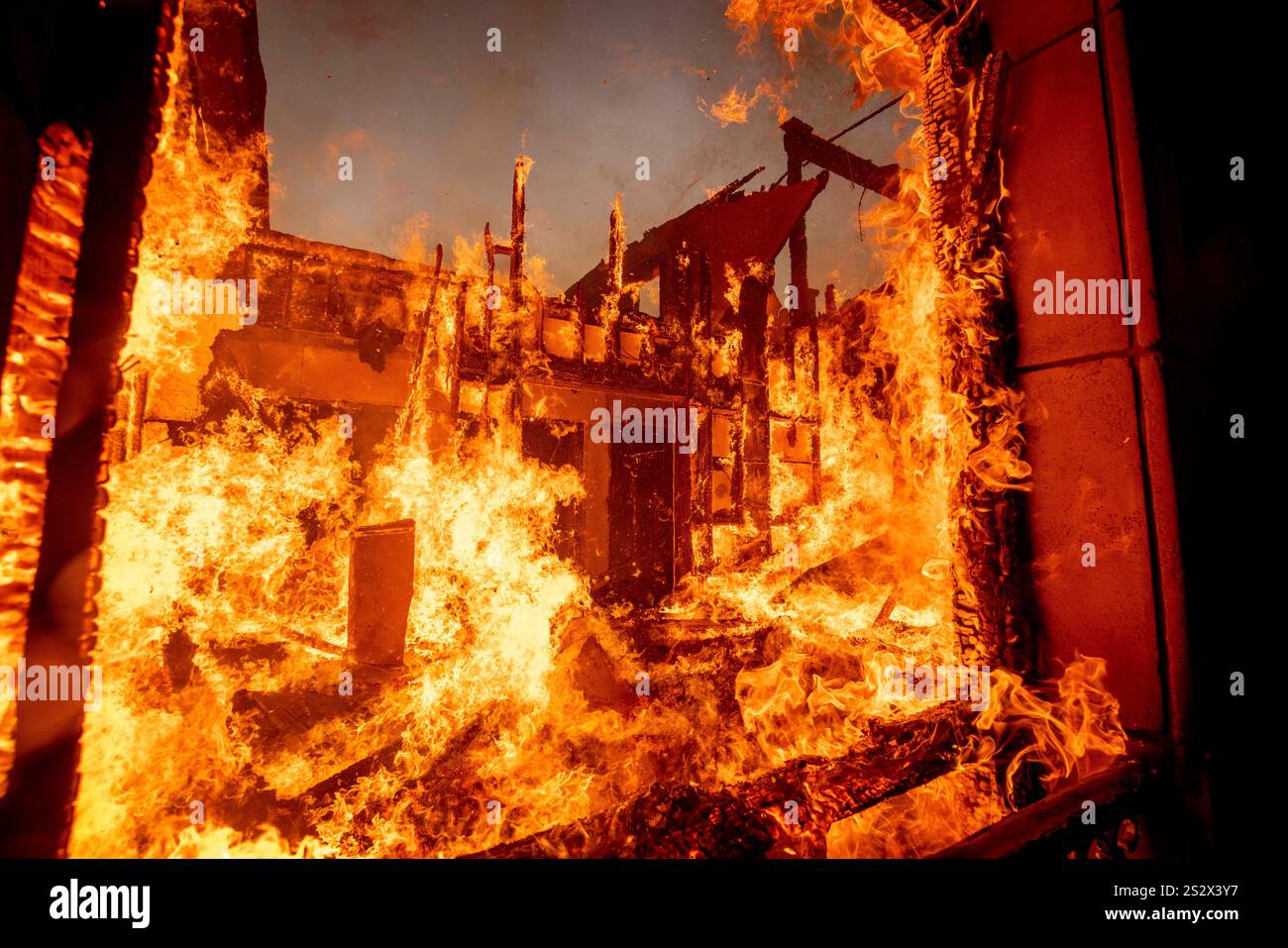 The Palisades Fire burns a residence in the Pacific Palisades