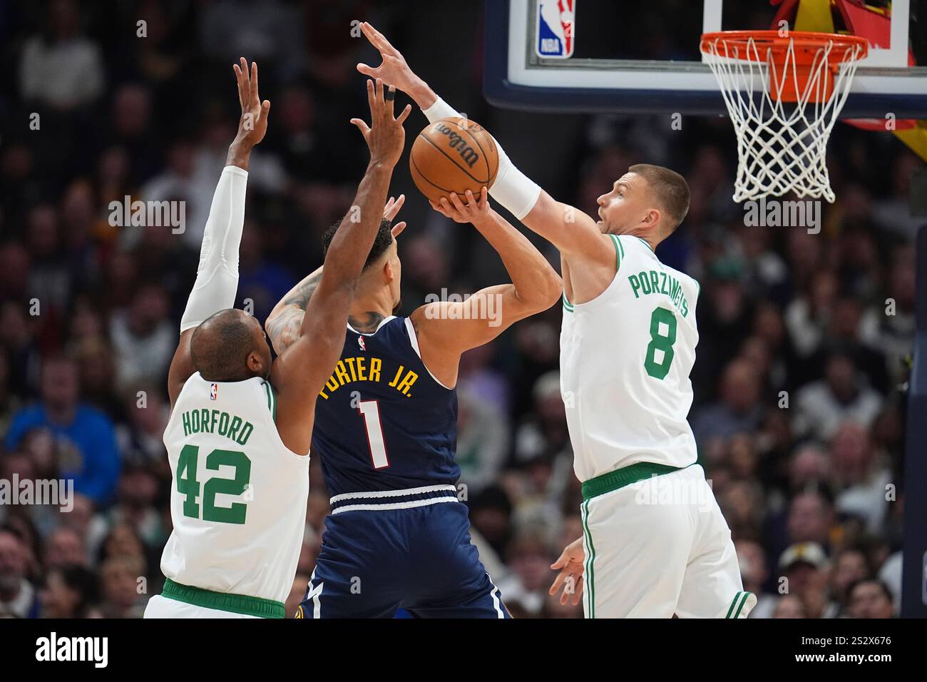 Denver Nuggets forward Michael Porter Jr., center, goes up for a shot