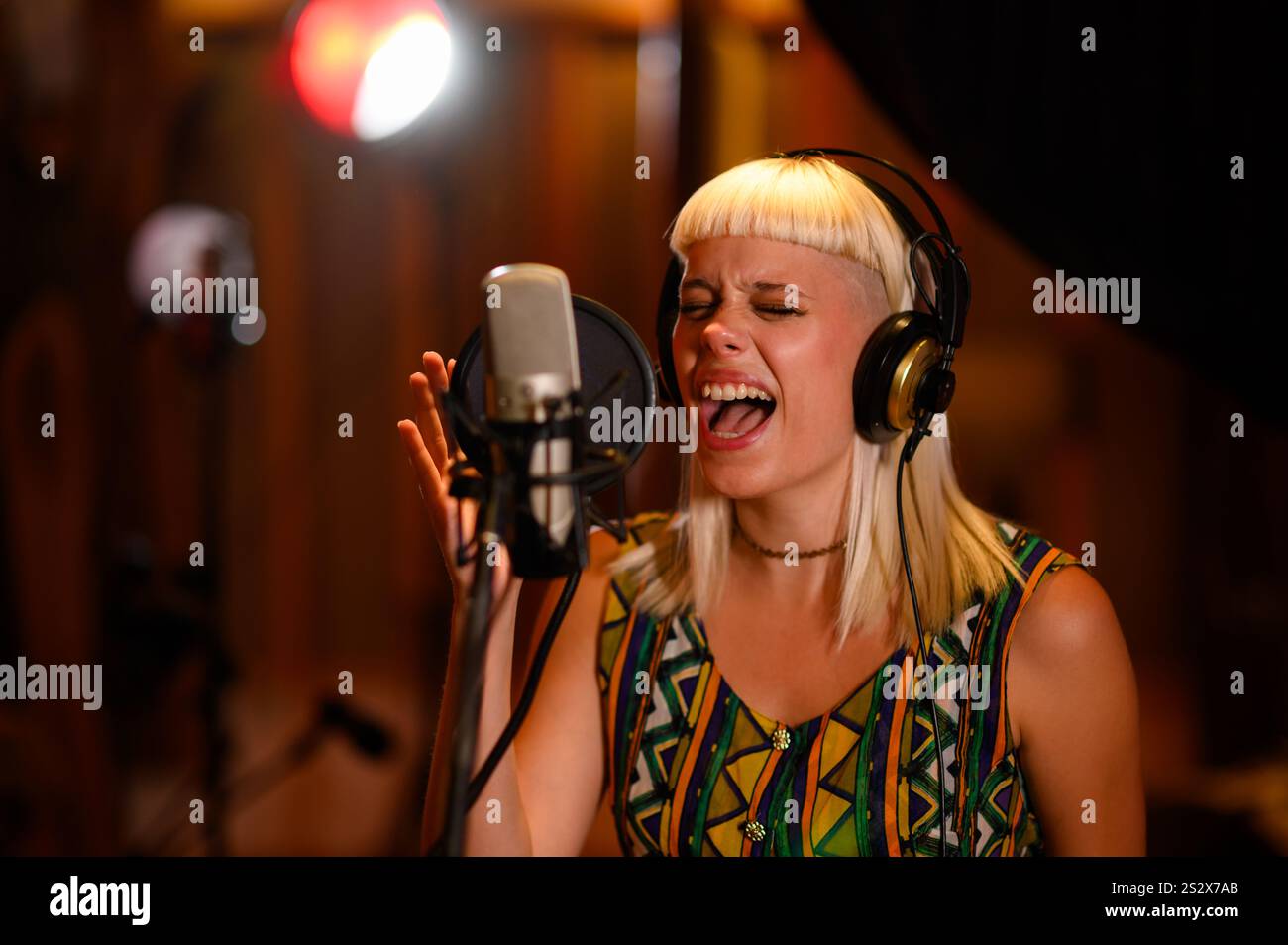 Mid Size Singer A young talented female singer singing her best performance in front of ...