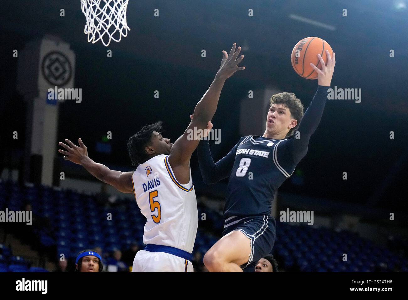 Utah State guard Drake Allen (8) drives to the basket against San Jose ...