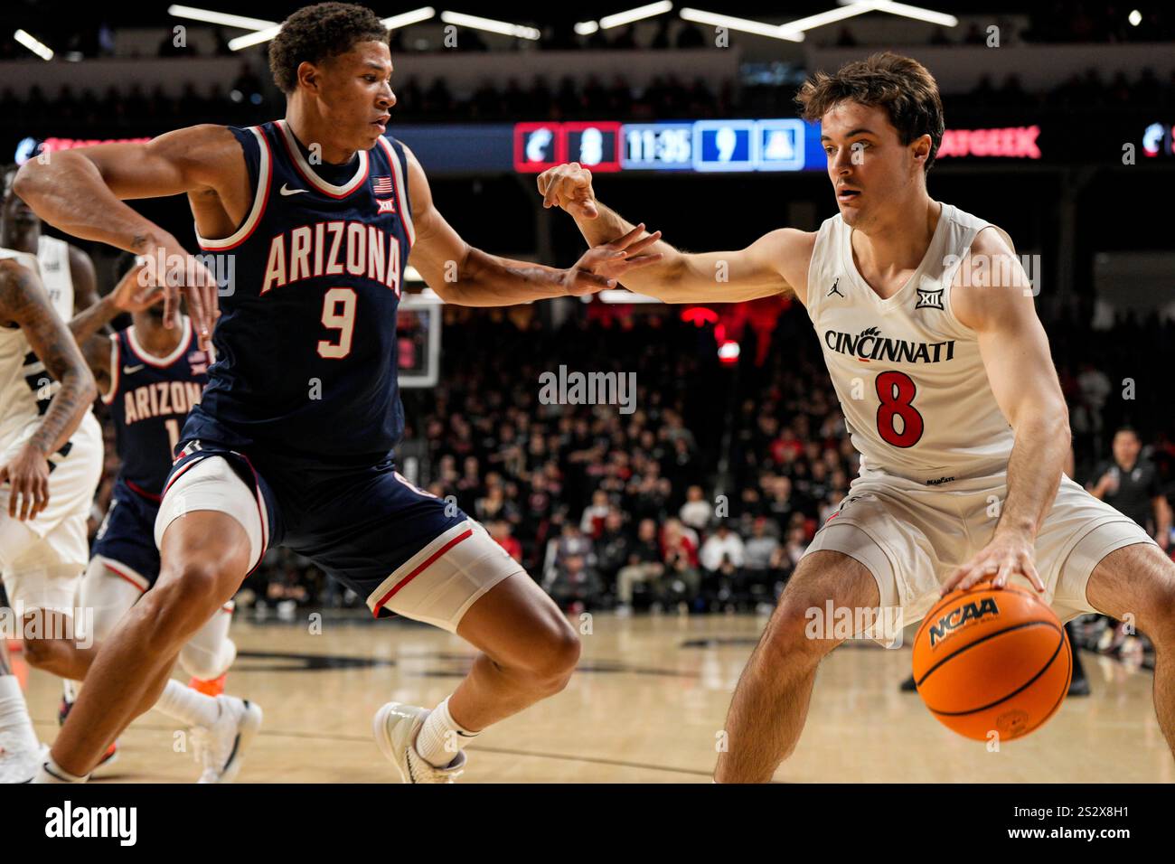 Cincinnati Bearcats guard Connor Hickman (8) dribbles against Arizona