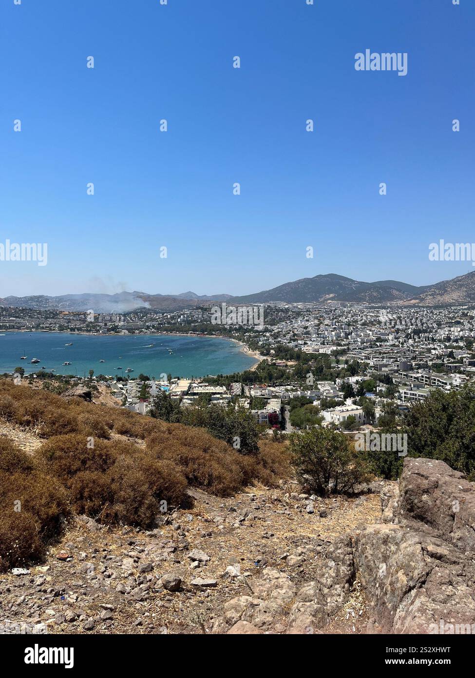 Panorama of the city Bodrum with mountains, sea and white houses. Blue sky, no clouds - Smartphone Captured Stock Image