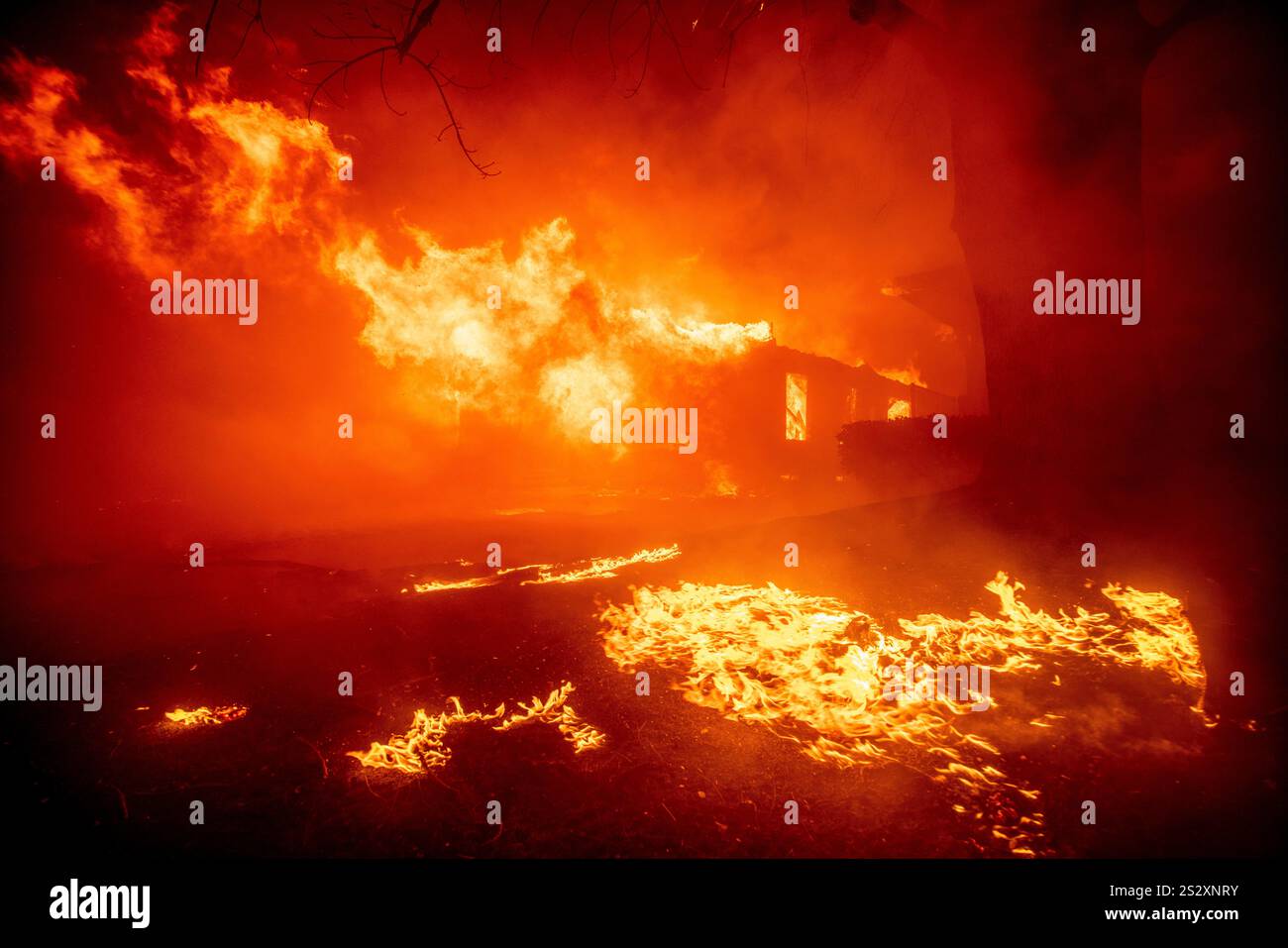 The Eaton Fire destroys a structure Tuesday, Jan. 7, 2025 in Altadena