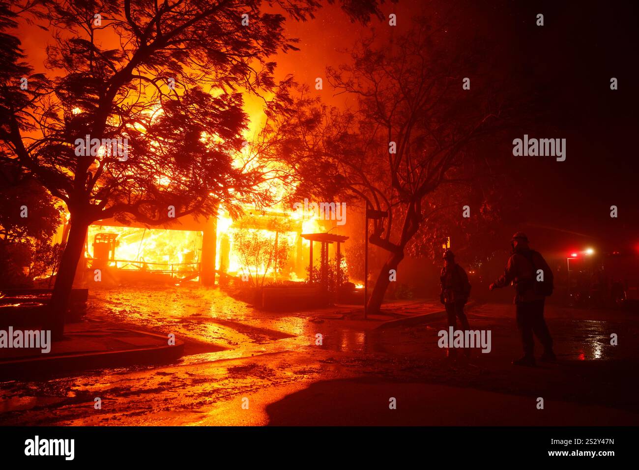 Firefighters battle the Palisades Fire in the Pacific Palisades