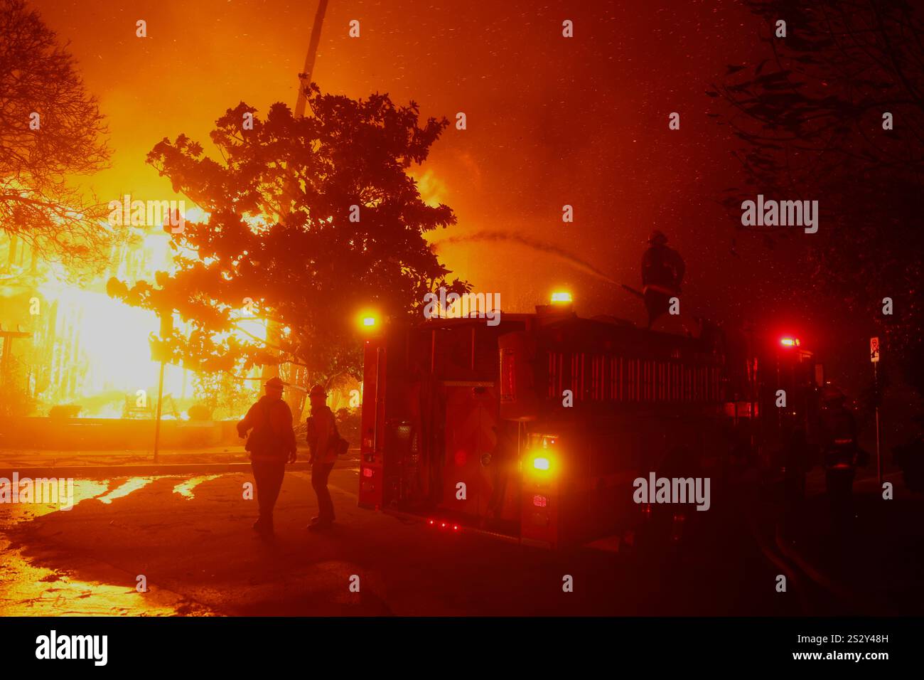 Firefighters battle the Palisades Fire in the Pacific Palisades
